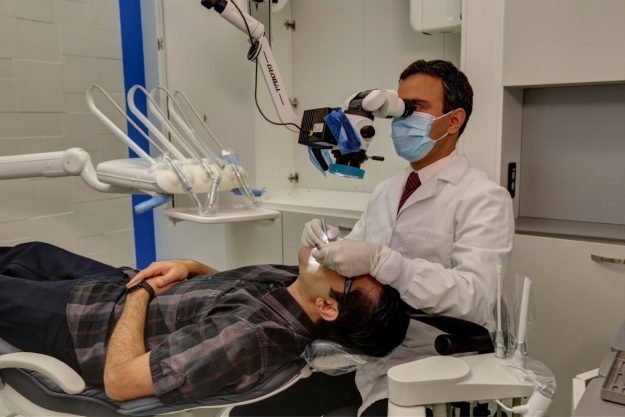 Dr-Kevin-Sameti-South-Houston-Endodontics Dr. Sameti working on a patient with cracked tooth